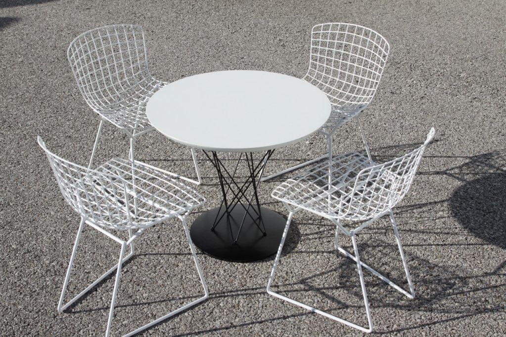 Isamu Noguchi designed this cyclone table to work en suite with Harry Bertoia's sculptural wire children's chairs. The child's table is frequently used as a side table. Table<br />
23.75 dia x 20h