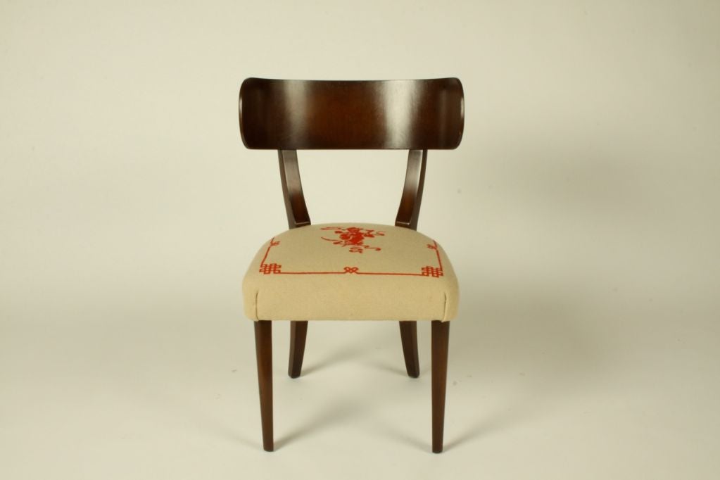 Desk chair with a dark walnut finish on mahogany, excellent original finish and with needlepoint seat.