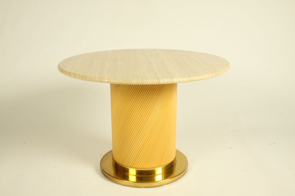 Bielecky side table with travertine top and brass and rattan base.