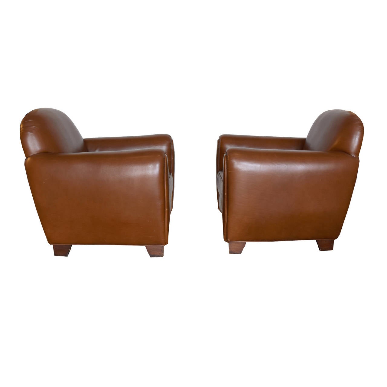 Pair of vintage French club chairs reupholstered in brown leather, purchased in Buenos Aires, Argentina.