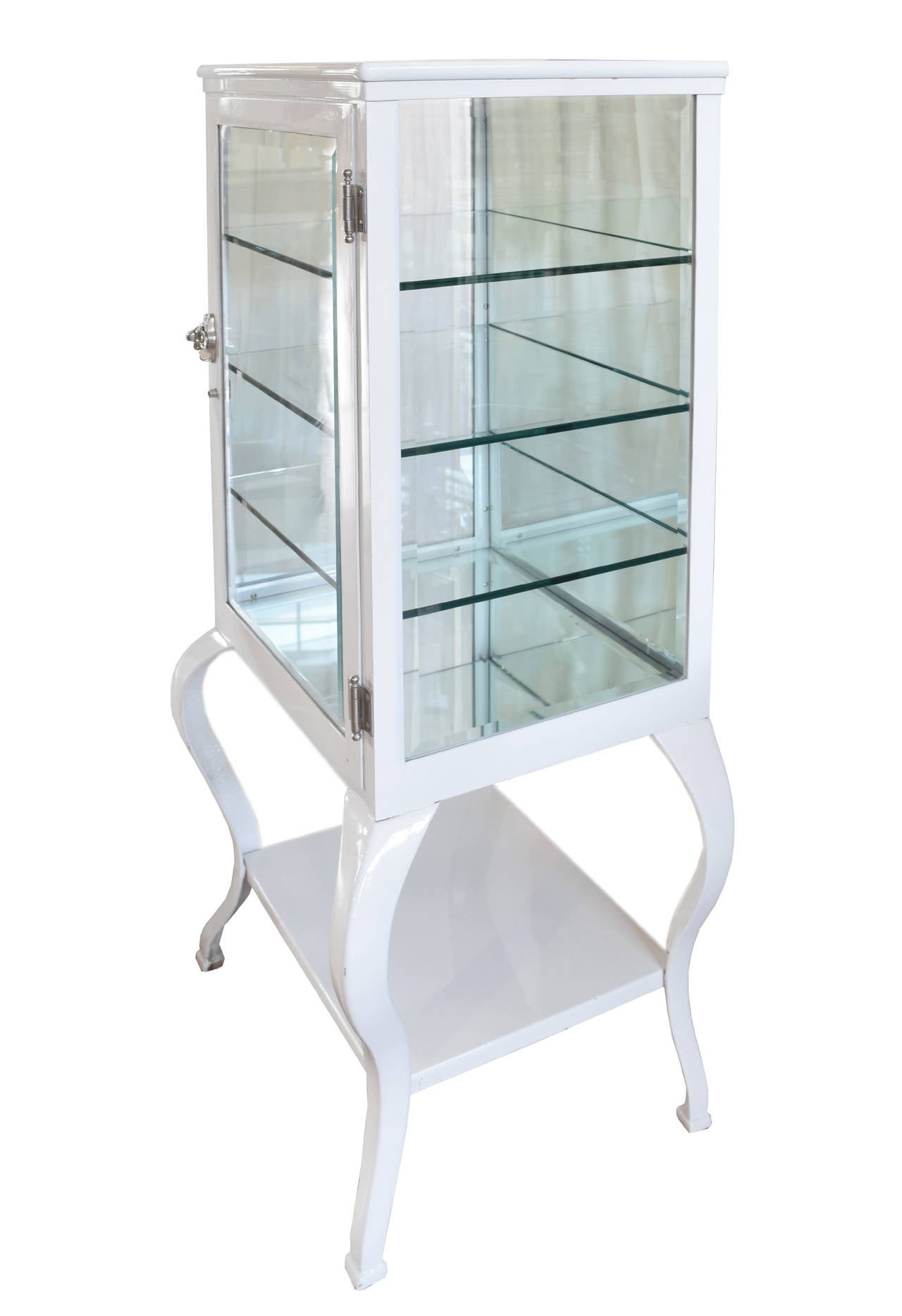 Early 20th century restored and painted display medicine cabinet with one exterior shelf, beveled glass sides, beveled glass door, mirrored back and three interior glass shelves.