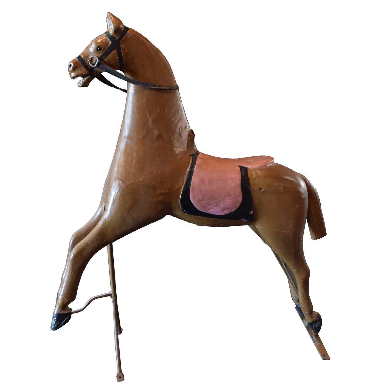 Early 20th century carved wood carousel horse with leather reins on original stand, from Argentina.
