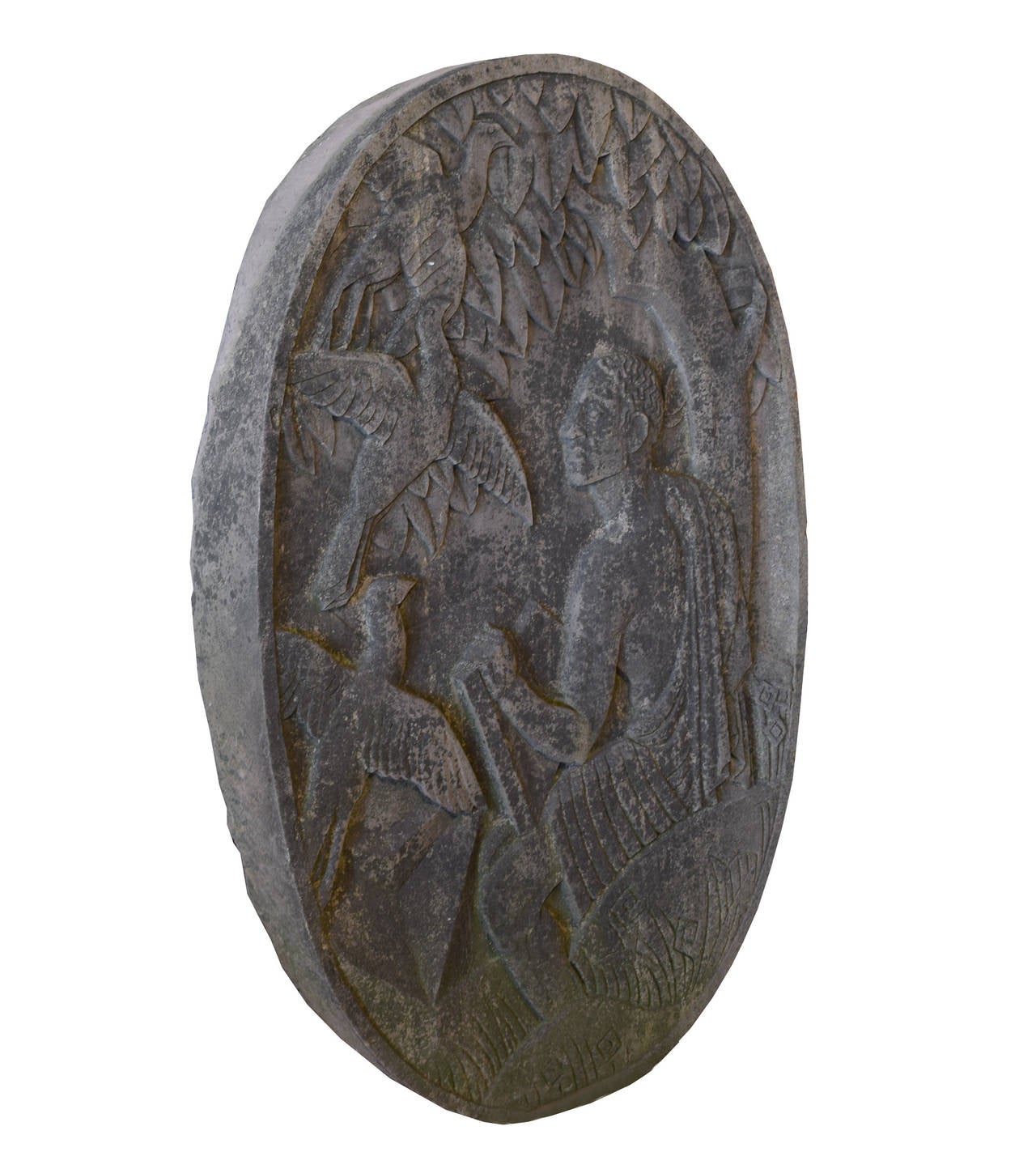 Early 20th century American carved limestone medallion with great patina from a Milwaukee Public School building, depicting a noble savage reading a book, seated below a tree, with three flying birds. Probably part of the W.P.A.