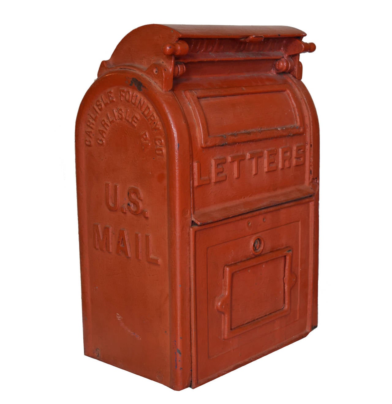 A cast iron U.S mailbox manufactured by the Carlisle Foundry Co. in Carlisle, PA. Painted red, circa 1930s.