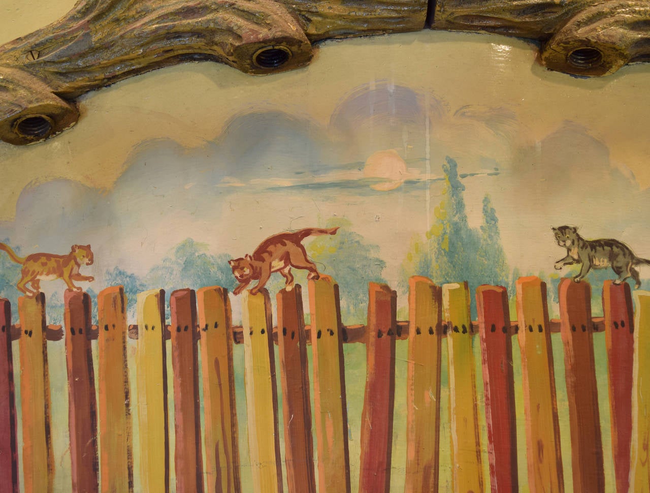 A rounding board from a ride at Riverview Amusement Park (1904-1967) in Chicago, Illinois depicting cats walking atop a fence.