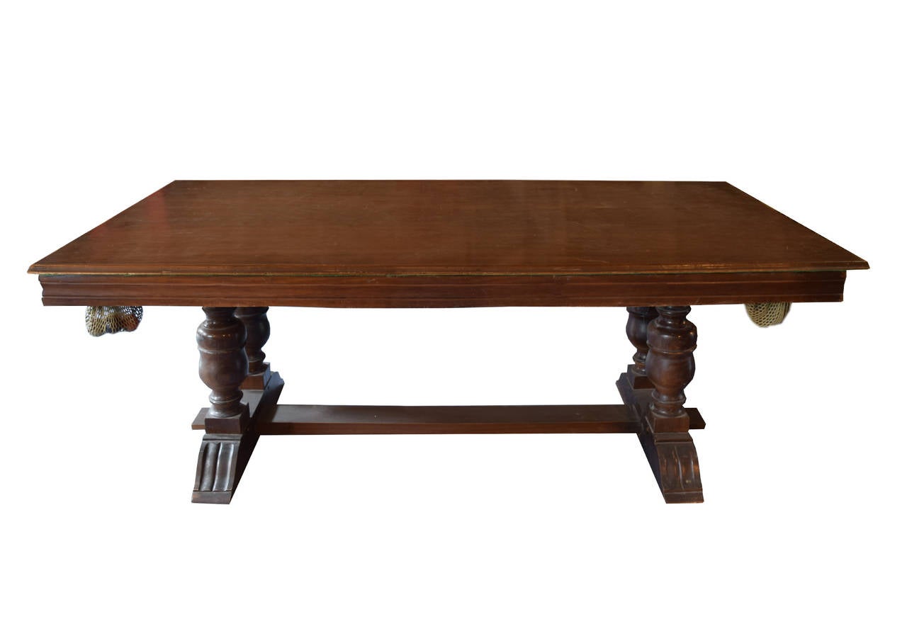 Early 20th century wood dining table from Argentina with four ornately carved legs and a removable top transforming the piece into a snooker table, complete with balls and two sticks.