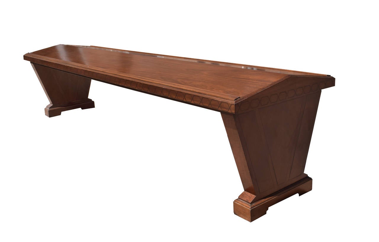 An American library reading table made of mahogany with ebony inlay. From Loyola University, Chicago.