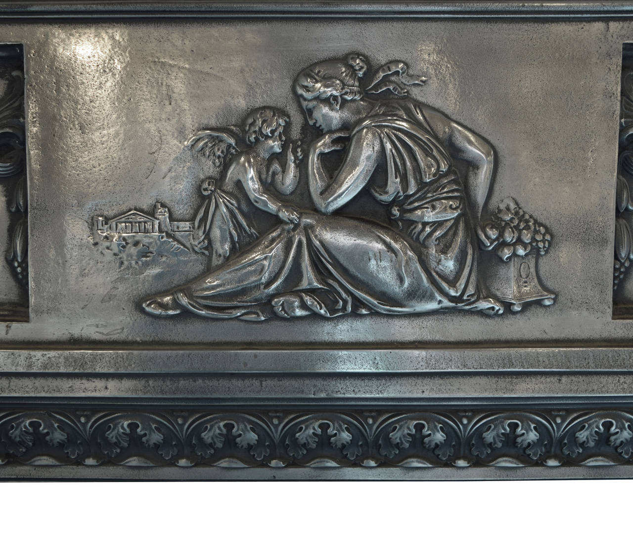 A 19th century English polished cast iron fireplace surround with a classical depiction of a goddess consorting with Cupid and decorated with other classical motifs like rosettes, floral festoons and acanthus leaf trim.
