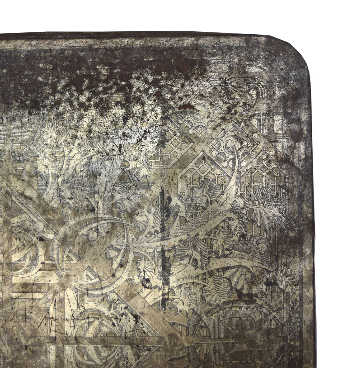 A galvanized tin stove board from circa 1920 by Louis Sullivan. These stove boards are documented as the last commissioned work of Sullivan before his death in 1924. Used to prevent house fires by protecting the floor from falling embers, these