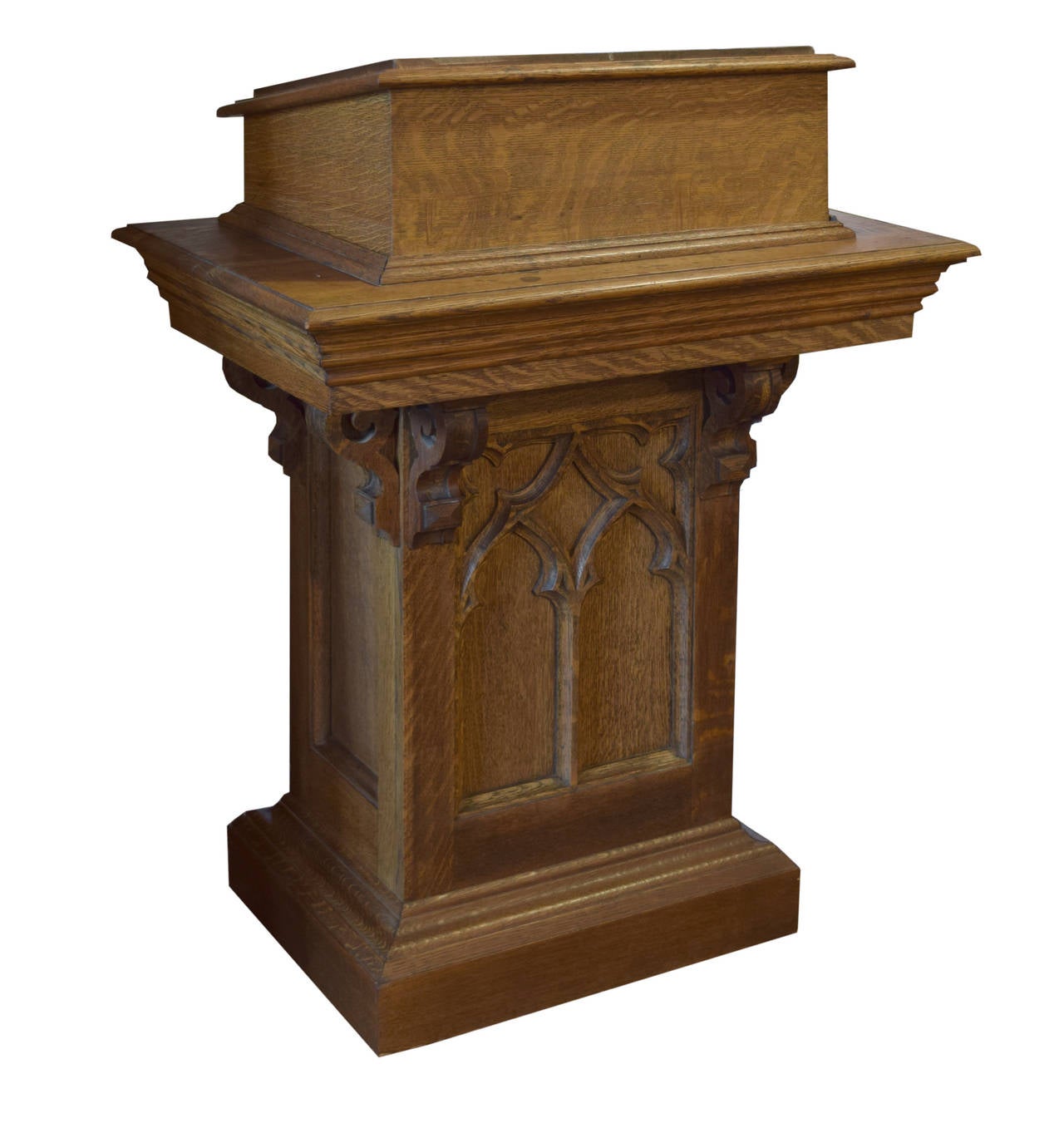 American Gothic carved oak lectern with arched paneled sides and an adjustable height slanted top with a waxed canvas pad, circa 1920.
