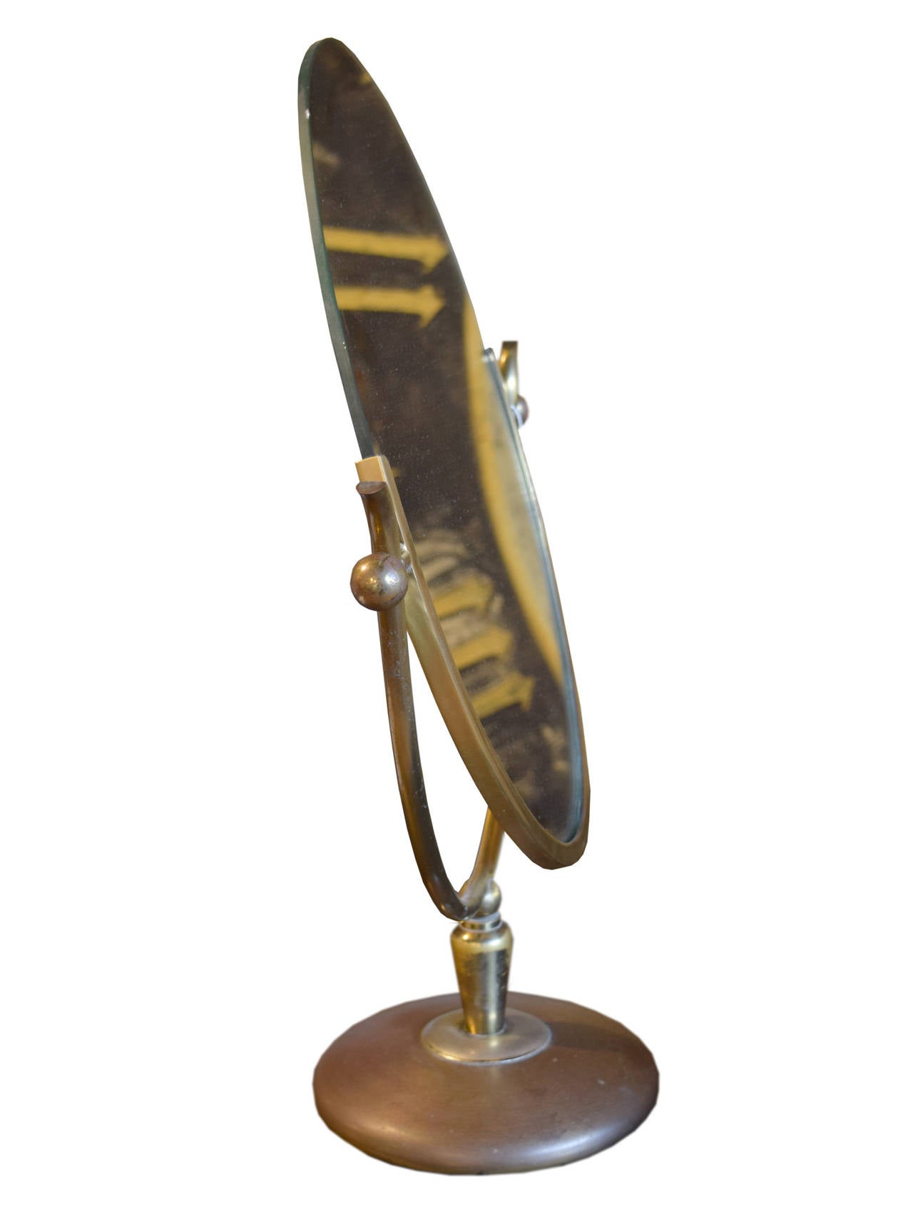 Adjustable oval mirror with a brass frame used in the Marshall Field's department store in Chicago, Illinois.