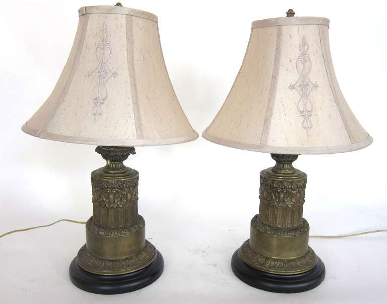 Pair of Bronze French Carcel Table Lamps with beautiful silk shades. These fine lamps were from the  family of Elizabeth Bowes Lyons ( the late Queen's mom). Double lights to each Very well done