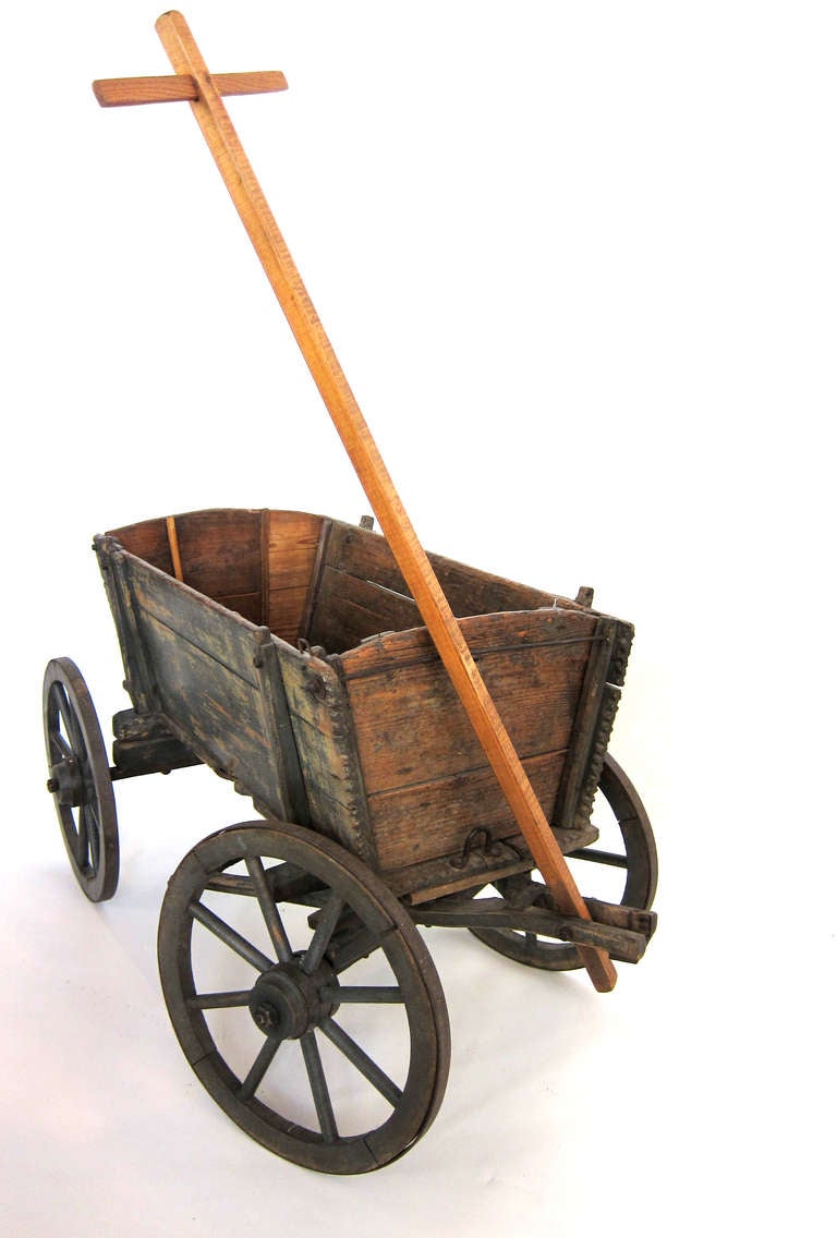 antique wooden wagon with metal wheels