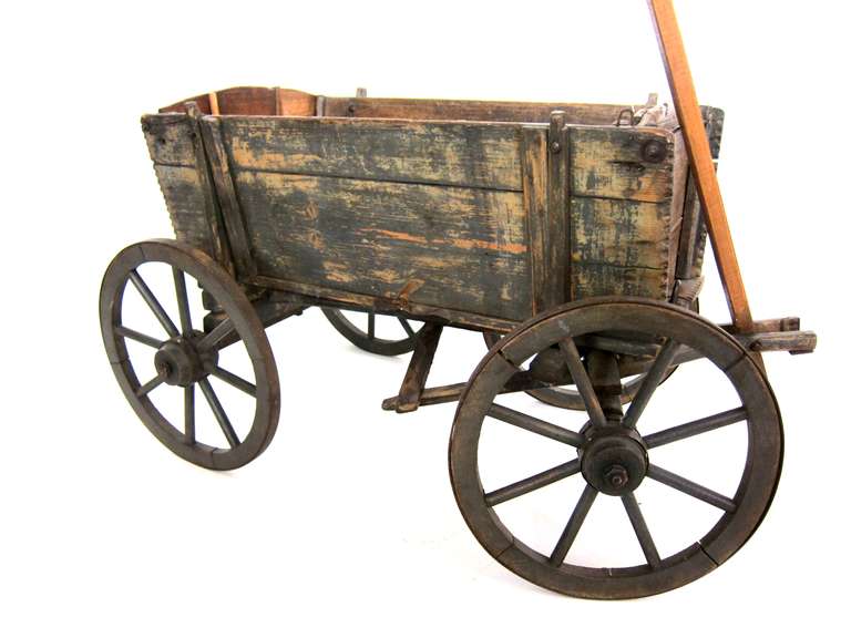 A working antique American wagon in great condition with steel wheels. Crafted with dovetail joinery.