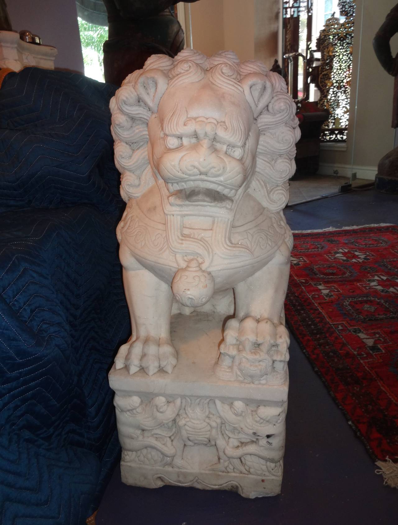 A pair of 19th century Chinese carved white marble foo dogs