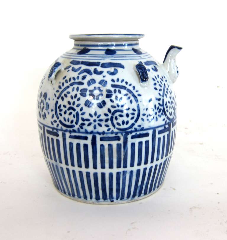 A beautifully painted Chinese Blue and White teapot with a geometric flora design.