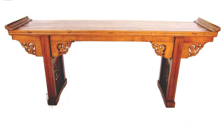 Beautiful 19th Century Chinese altar table expertly carved from Chinese Elm Wood using traditional mortise and tenon joinery. Two legs with hand carved screen to each side.