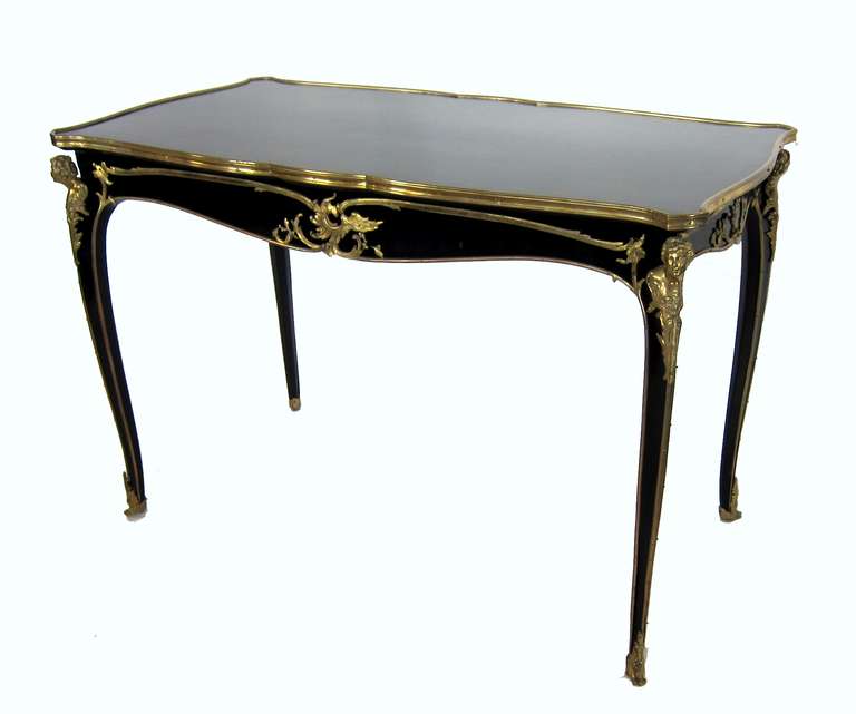 An excellent Figurel Salon Table / Desk, with a bronze dorie and a beautiful Black finish having a parquet square design to the top.
In the manor of Francois Link.