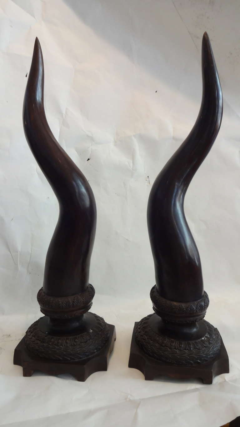 This pair of Bronze Tusks are in one piece each. Very well made they look be be mounted on the stands but are one piece and being of the same size. Beautiful patina. The stands have a 