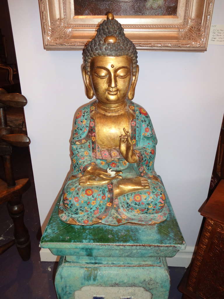 A Chinese cloisonné seated buddha, turquoise ground with gold leaf