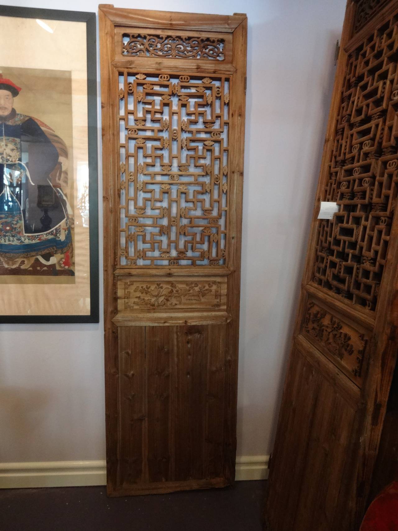 A set of four Chinese elm wood carved screen door panels. Each panel measures 26