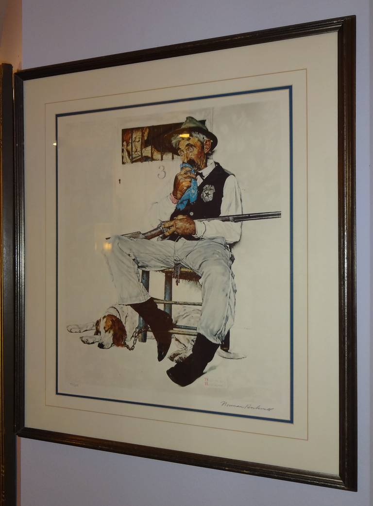 A signed and framed Norman Rockwell lithograph, titled 