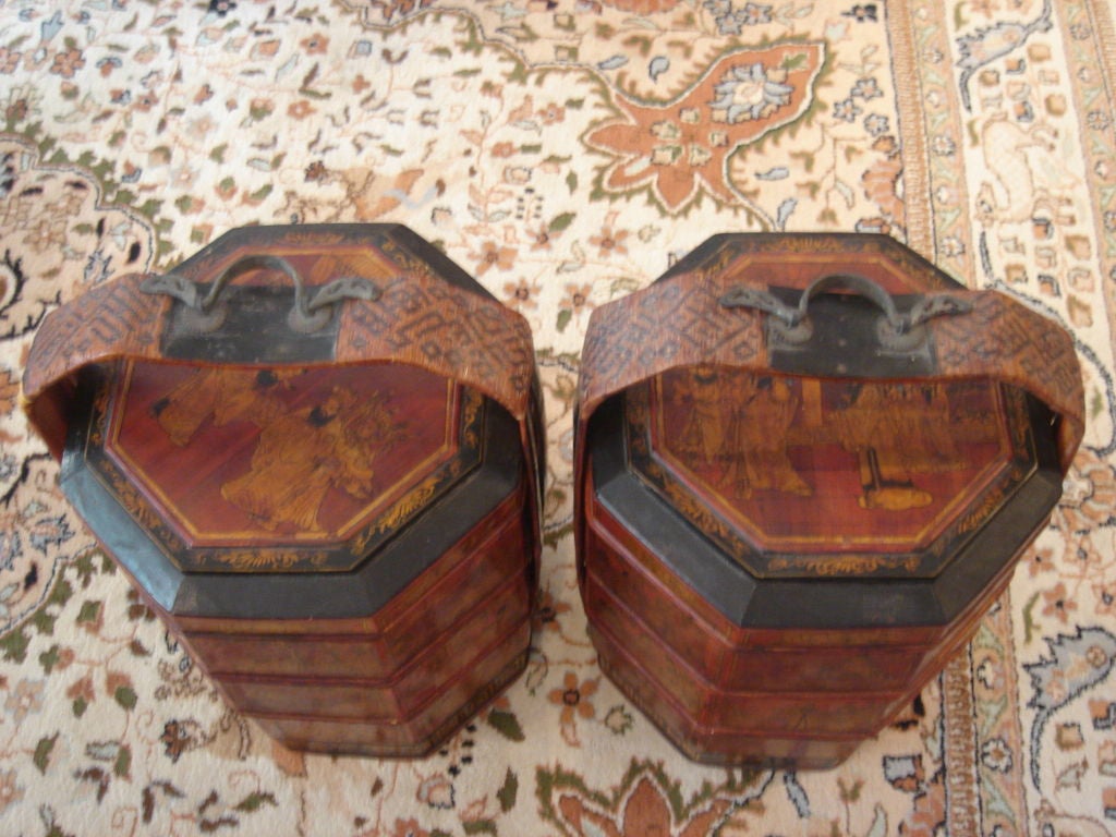 A Pair of Chinese WEDDING BASKET 3 trays each with lid, black lacquered, red lacquered and gold leaf.  Handles woven with iron handles