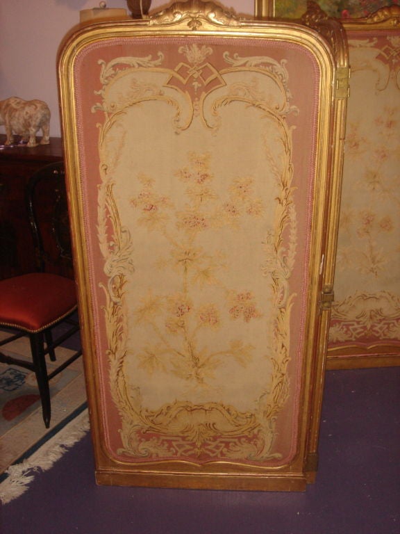 French Three panel SCREEN Paravert inset with matching tapestry and bread to one side and delightful embroidary of flowers to the other.  Gold leaf hand carved frame. The three panels bend both back and forth.