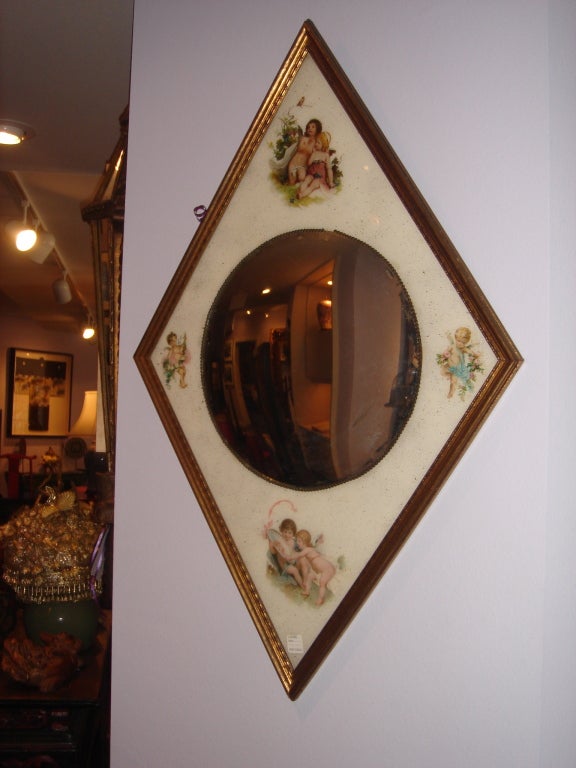 This French Secret Society Mirror is Diamond Shaped with gold leaf frame, Provence Lala Stack, Bull's Eye Mirror reverse hand painting on glass of cupids. Fabulous!