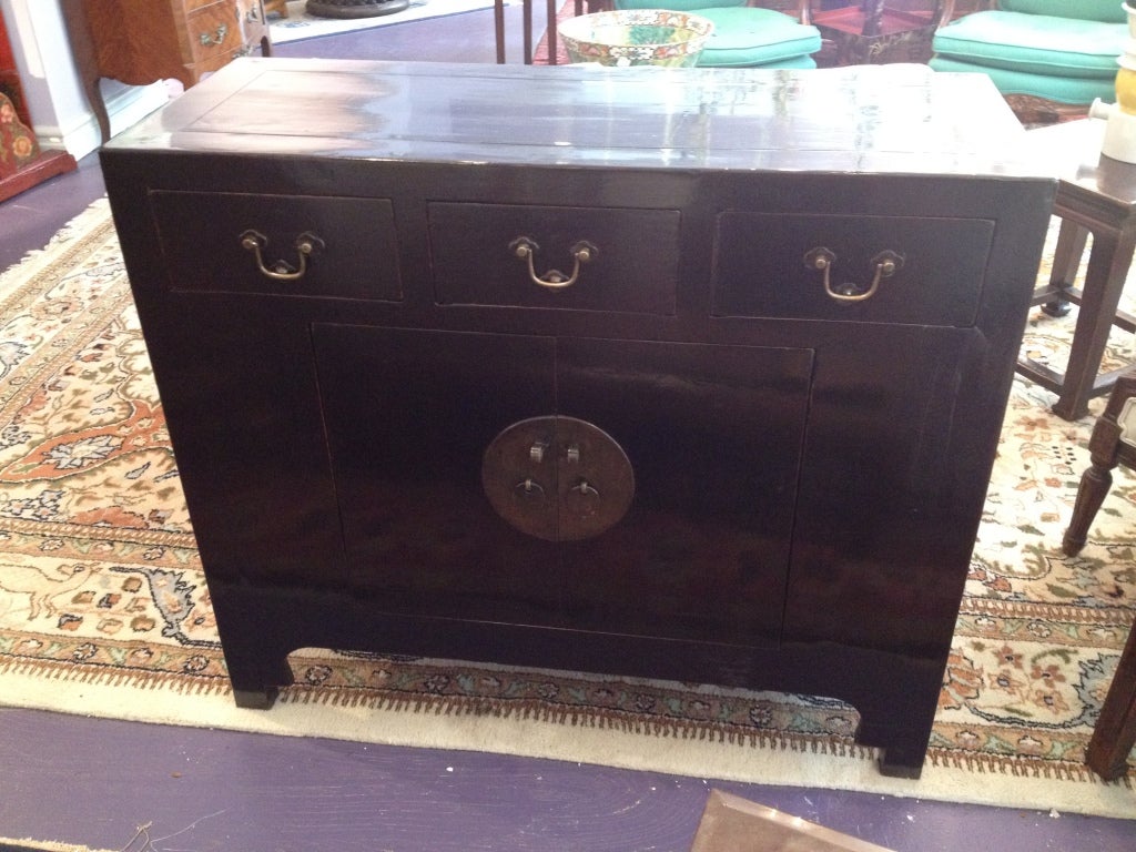 Beautiful black lacquered Elm wood Chinese CABINET/BUFFET with 3 drawers to the front and a pair of doors under.  Having a Ming style hardware to the drawrs and doors.  Well taken care of from Shanxi Provence, China