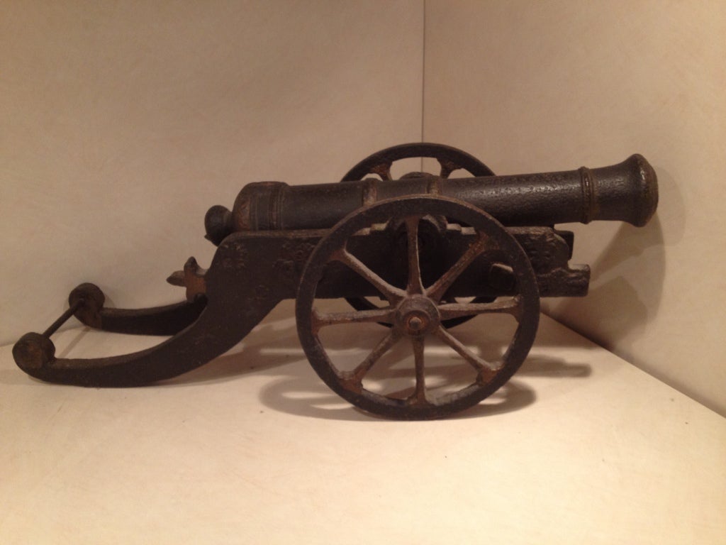 This bronze and iron French Ship's Signal Cannon would have been used to enter ports of call, salute persons and attract attention.  The wheels move and it can be putted by the carriage. Open at the touch hole. Of course hand made. Wonderful for a