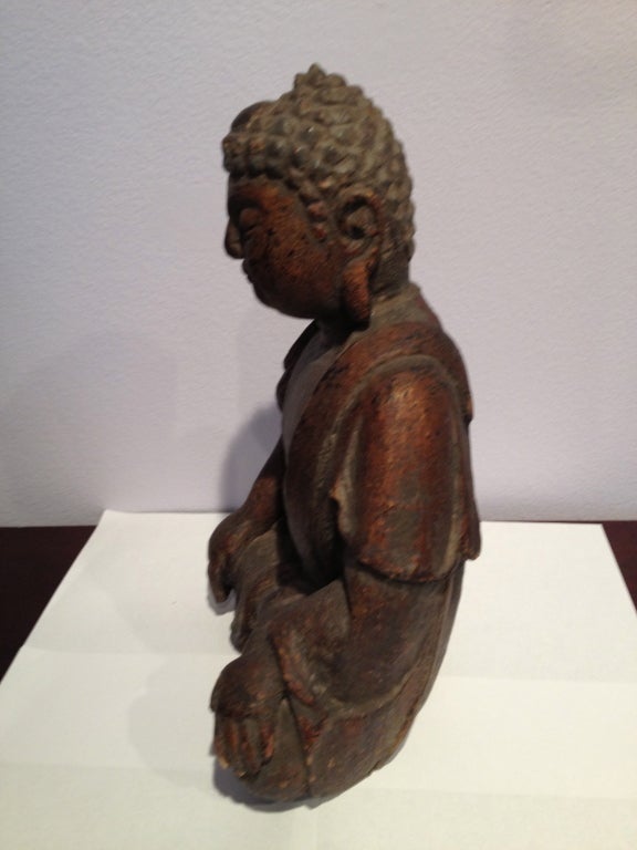 This small hand carved poplar wood Sitting BUDDHA is in rest. Hand carved with finish of gold/copper leaf (remain) Yes, this is the second Buddha which came from a temple in the Shanxi Provence, China