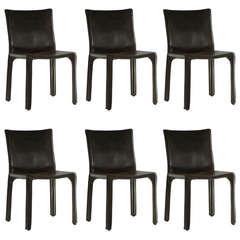 Six Black Leather Chairs by Mario Bellini