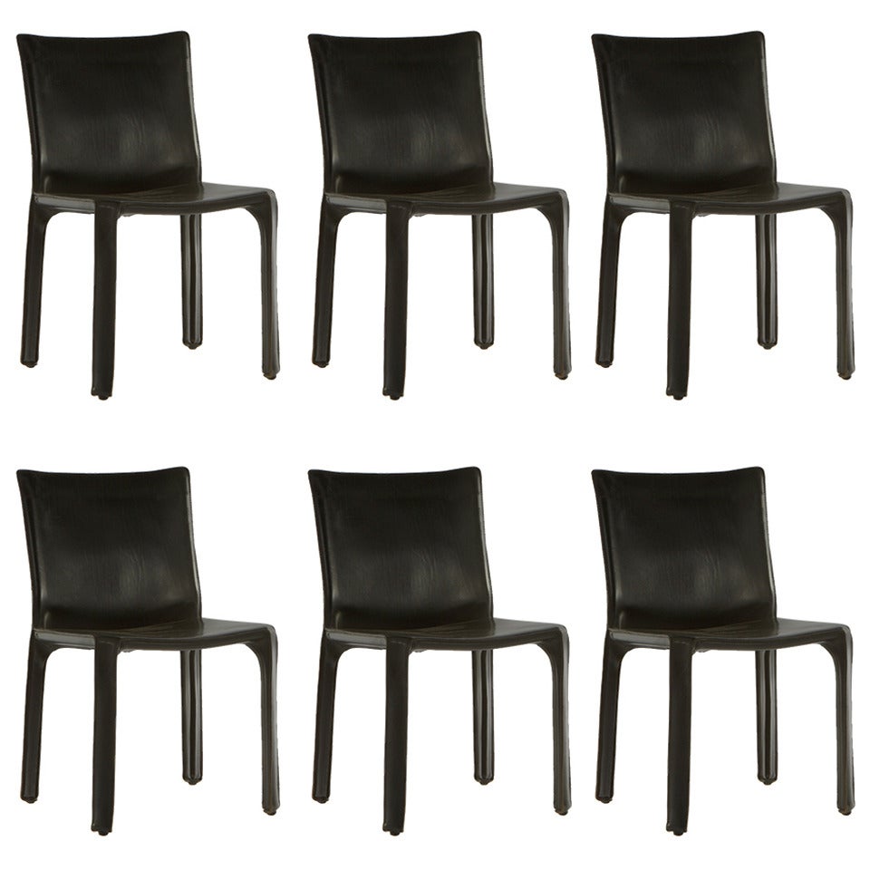 Six Black Leather Chairs by Mario Bellini