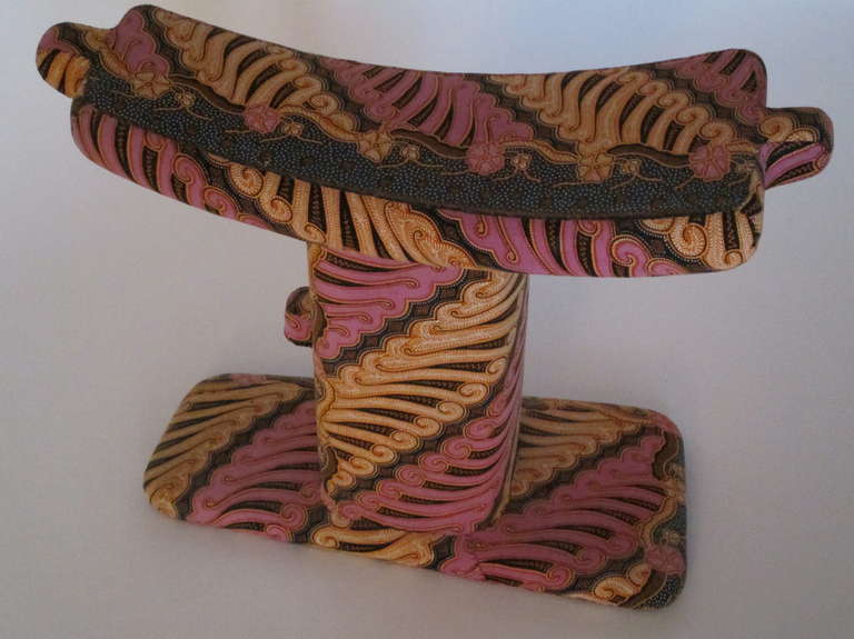 Handstitched and covered batik print African stool.