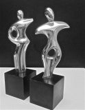 PAIR OF STYLIZED MALE 
FEMALE ALUMINUM SCULPTURES