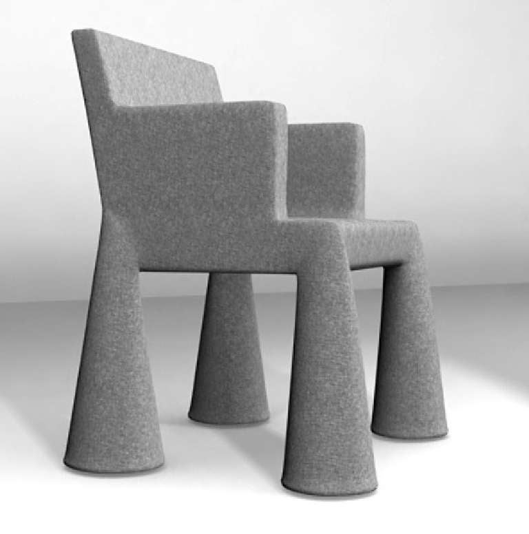 THE VIP CHAIR WAS DESIGNED FOR THE WORLD EXPO 2000 IN HANOVER. THE CHAIR IS COMPLETELY UPHOLSTERED WITH A WOOLEN FELT LIKE TEXTILE.  THE UPHOLSTERY COVERING THE LEGS OF THE CHAIR HANG LOOSE, LIKE TROUSER LEGS AND GIVEN TO HIDDEN WHEELS WHEN the 