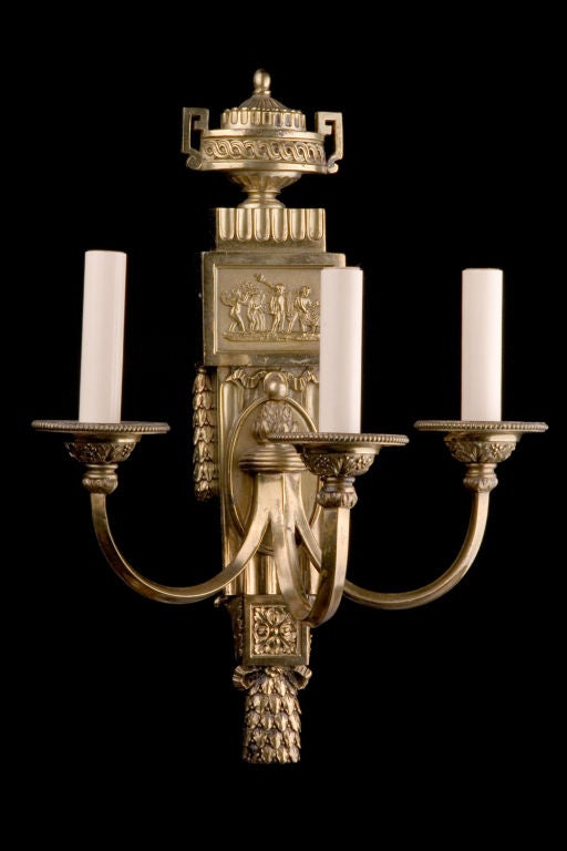 Pair of 3 light neo classical style sconces by E.F. Caldwell, NY circa 1900, with top urn detailing and rectangular frieze.