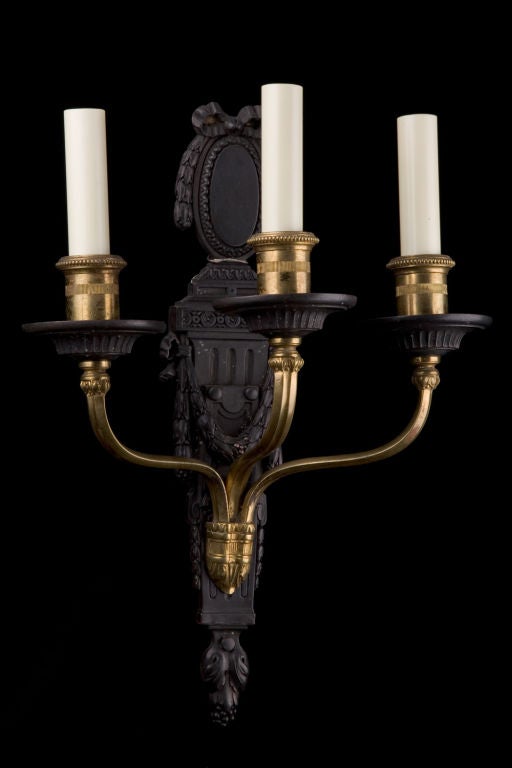 Pair of Louis XV style sconces by EF Caldwell of NY, circa 1910  In gilt bronze and statuary bronze.