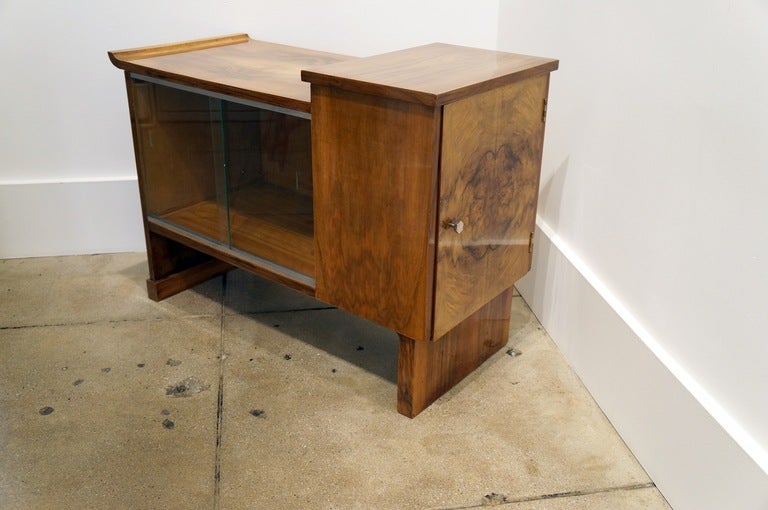 Art Deco Walnut Cabinet c. 1940. Sliding glass doors and single cabinet door on the side.