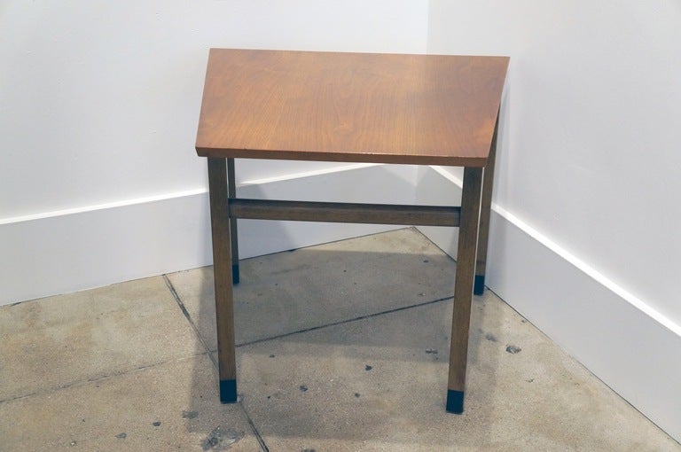 Walnut asymmetrical side table with a warm mahogny top and leather anklets. The length @ the back is 26" tapering to 18" in the front. Original two stain finish. 