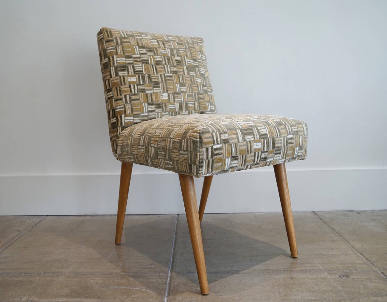 T.H. Robsjohn-Gibbings desk chair for Widdicomb.

Newly upholstered in Lee Jofa, wood cut velvet, (stone).
Springs and webbing also replaced, original finish to the legs.
