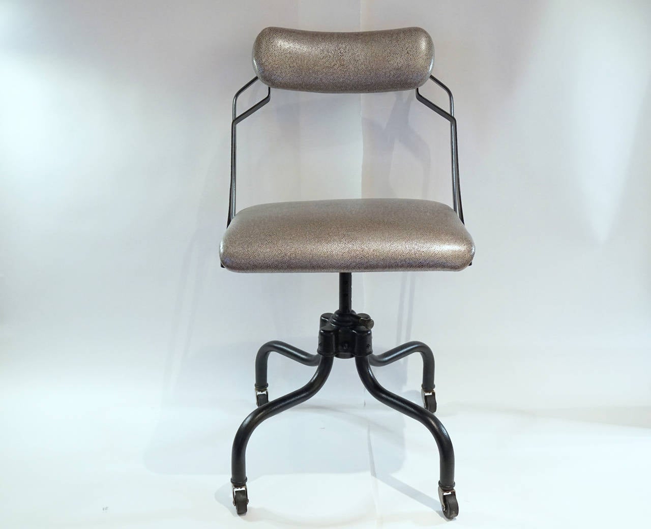 Fabulous stenographers chair by Reminton-Rand Sitwel.Interesting early ergonomic design with multiple adjustments. Powder coated fram and new Edleman faux shagreen leather upholstery.