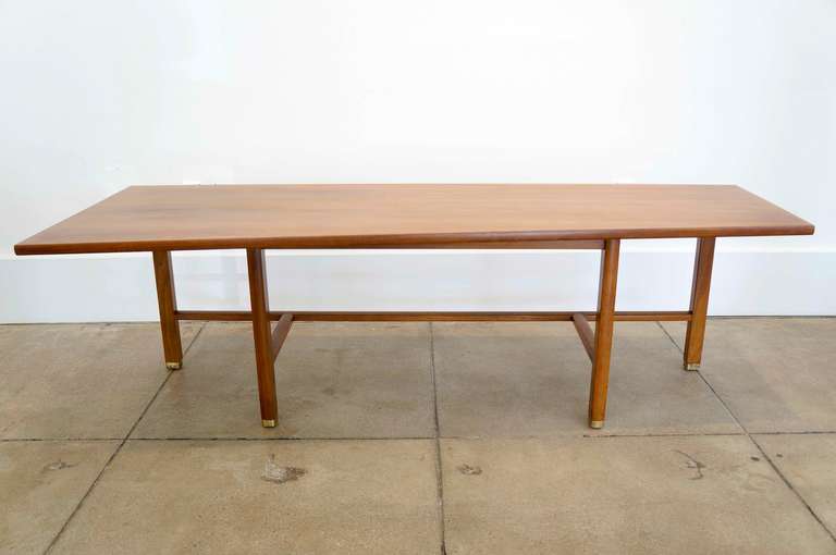 Walnut coffee table with rectangular brass sabots ... Edward Wormley for Dunbar. Parallel ends 22 x 16