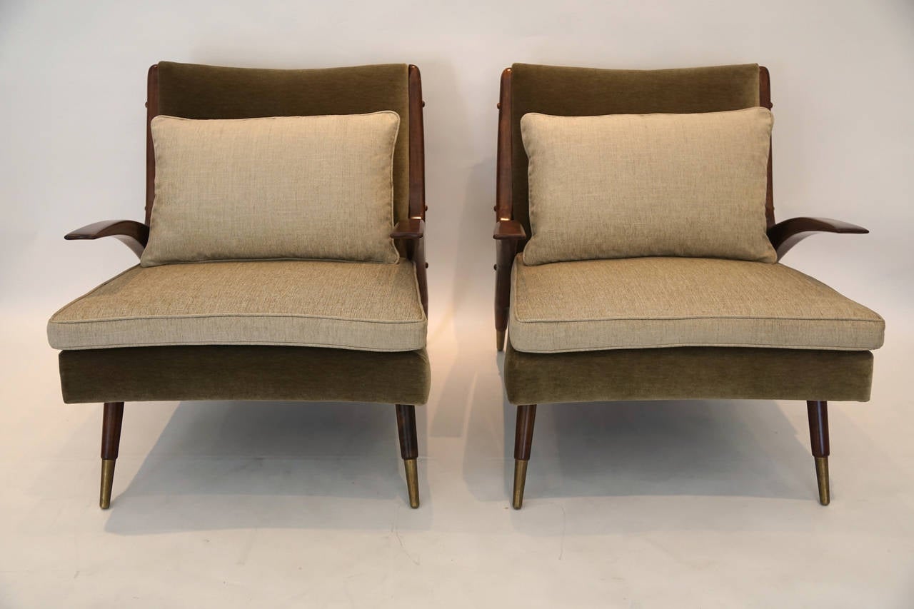 Pair of modernist lounge chairs with asymmetrical floating arms. Full restoration to include the ribbon-mahogany, sage and bone upholstery.

Minimalist, modernist.