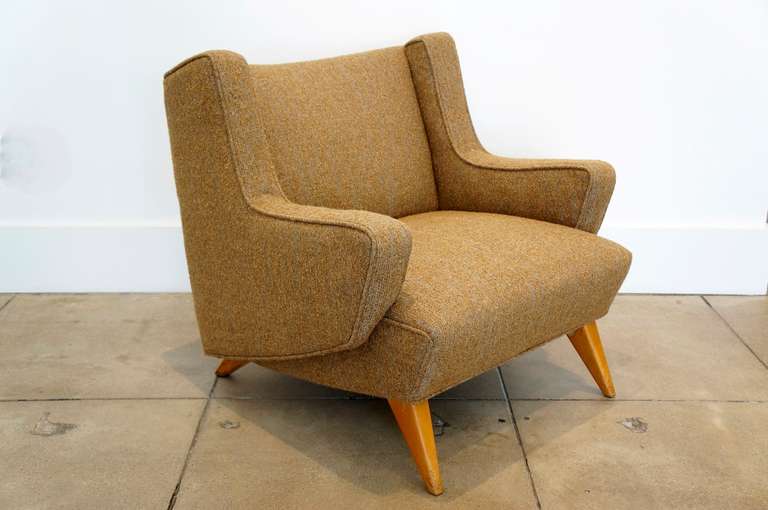 Rare Jens Risom club chair upholstered in a cognac and gold boucle fabric.