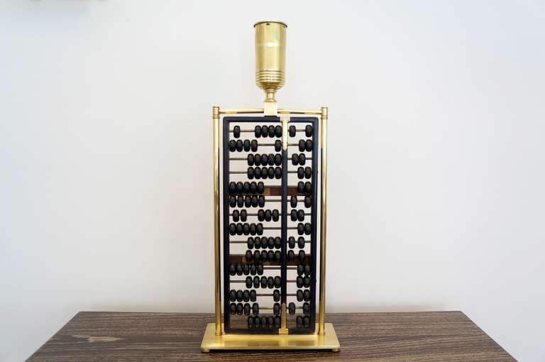 Abacus surrounded by solid brass machined fittings. Original from Hong Kong. The porcelain Edison socket is complete and intact and has been rewired with UL parts.
