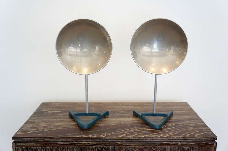 A pair of stand alone sculptural objets, adjustable in height and position! The foot print of each is 20.5