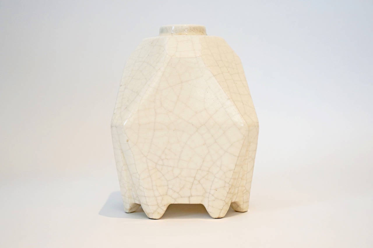 A multi faceted white crackle glaze vase attributed to Atelier Primevera Au Printemps.