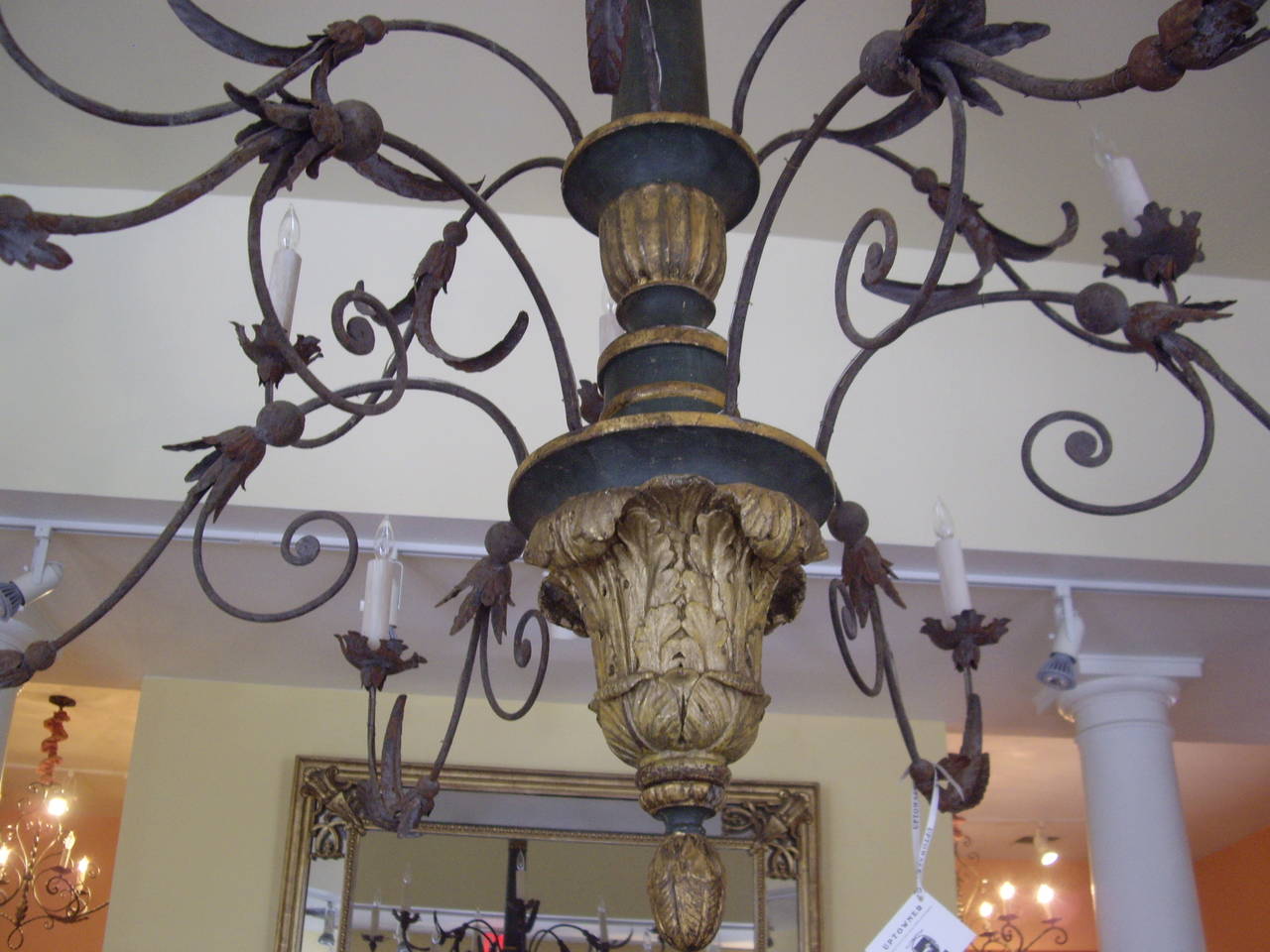 Large very elegant Italian painted giltwood and iron twelve-light chandelier.